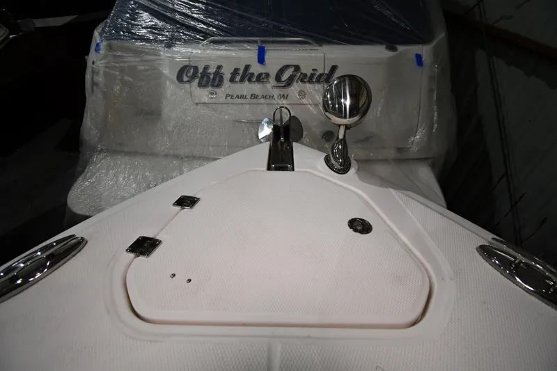 Slide: The Image of 2014 Chaparral 327 SSX boat with "Off the Grid" nameplate, Pearl Beach, MI. - 2