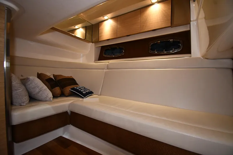 Slide: The Image of Luxurious interior of 2014 Chaparral 327 SSX boat with plush seating and ambient lighting. - 23