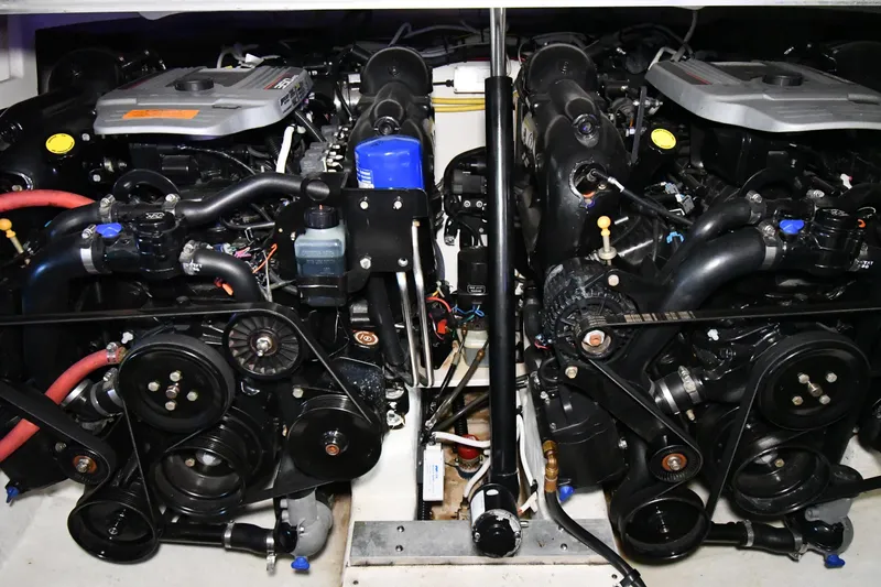 Slide: The Image of Engine compartment of a 2014 Chaparral 327 SSX boat, showcasing dual engines and components. - 33