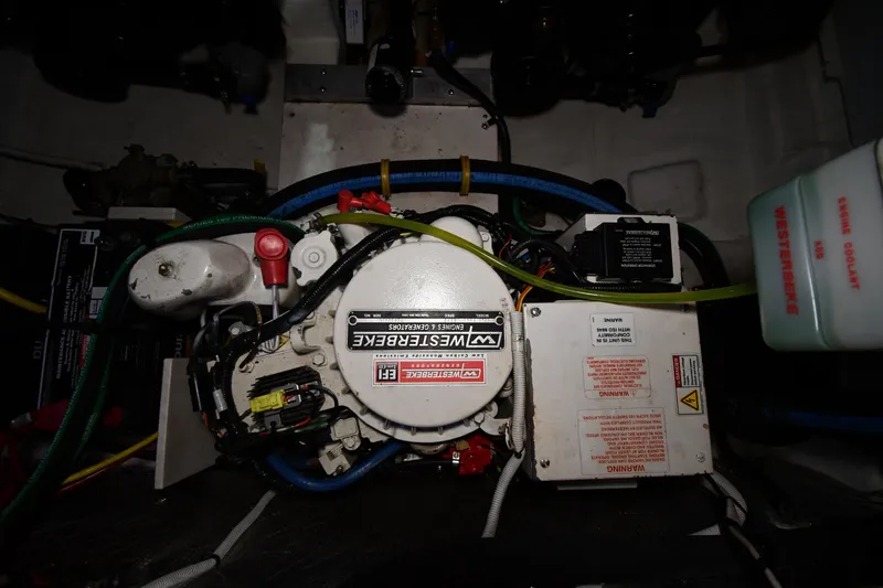 Slide: The Image of Engine compartment of a 2014 Chaparral 327 SSX boat with Westerbeke generator. - 36