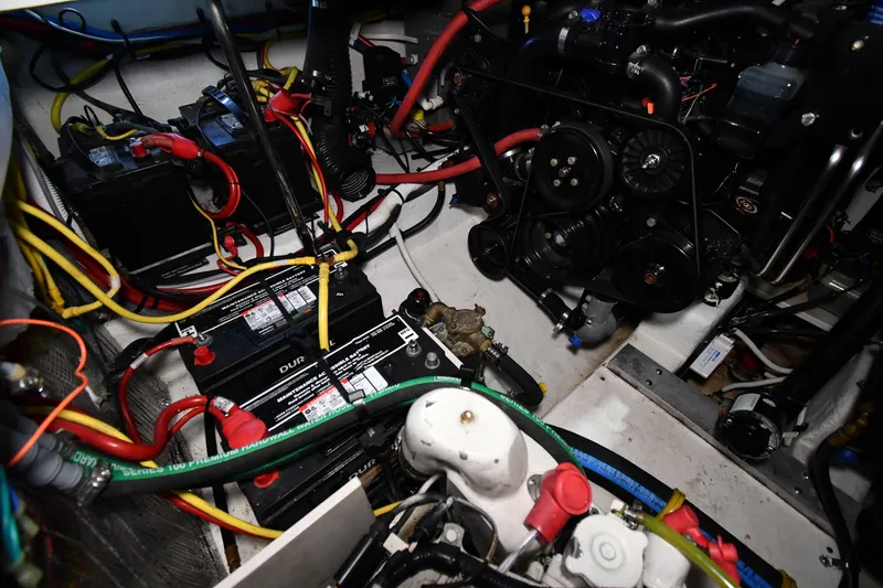Slide: The Image of Engine compartment of a 2014 Chaparral 327 SSX with batteries and wiring. - 37