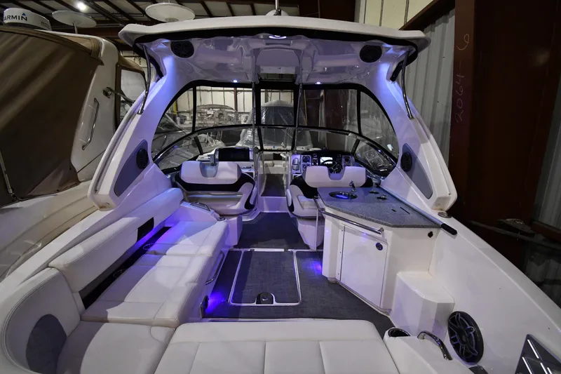 Slide: The Image of Luxurious interior of a 2014 Chaparral 327 SSX boat with modern seating and ambient lighting. - 4