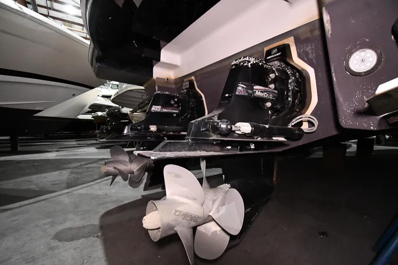 Slide: The Image of 2014 Chaparral 327 SSX boat with dual MerCruiser outdrives in a storage facility. - 46