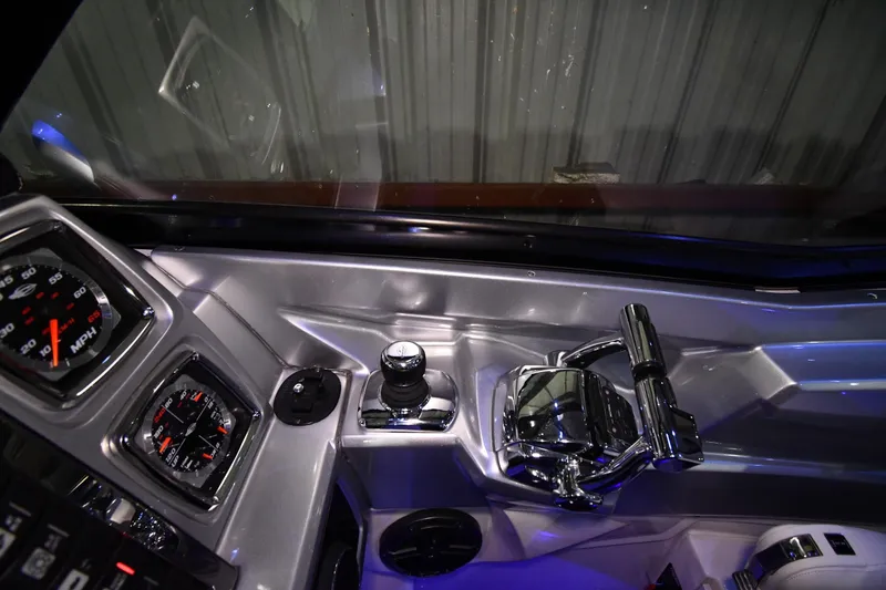 Slide: The Image of Dashboard of a 2014 Chaparral 327 SSX boat with gauges and controls. - 8