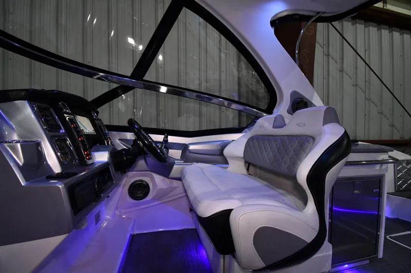 Slide: The Image of Interior of 2014 Chaparral 327 SSX boat with modern dashboard and luxurious seating. - 9