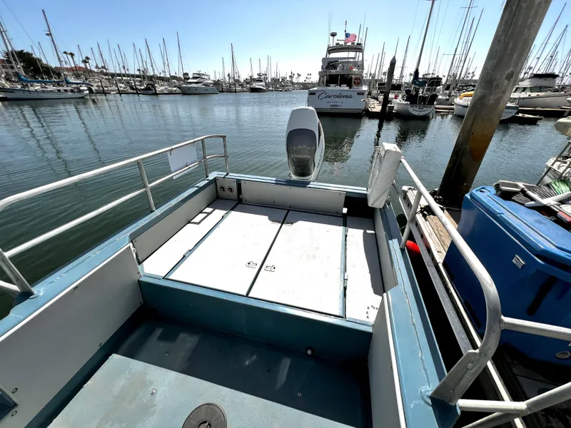 Slide: The Image of Open deck of a 2003 ACB 30 boat docked in a marina. - 12