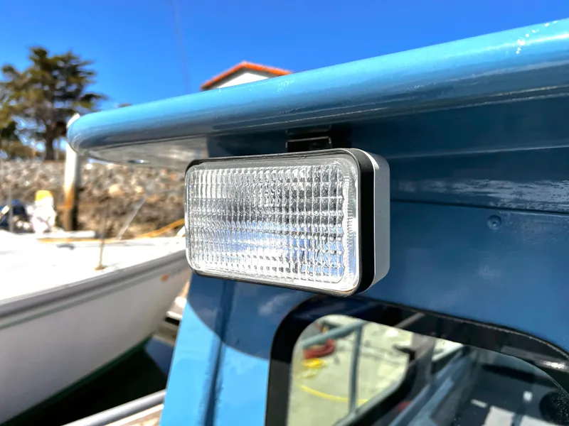 Slide: The Image of Close-up of a mounted light on a blue ACB 30 boat, 2003 model. - 6