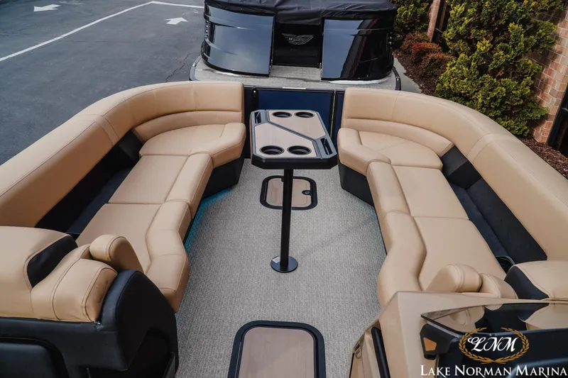 Slide: The Image of Luxurious 2026 Evotti 725QL pontoon boat interior with plush seating and table. - 12