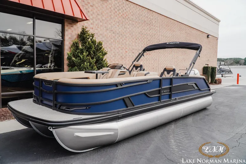 Slide: The Image of 2026 Evotti 725QL pontoon boat displayed at Lake Norman Marina. - 2