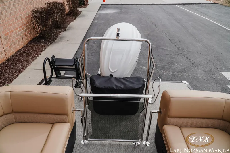 Slide: The Image of Evotti 725QL 2026 boat interior with beige seating at Lake Norman Marina. - 20