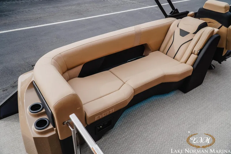 Slide: The Image of Luxurious seating on 2026 Evotti 725QL boat with beige upholstery and cup holders. - 8