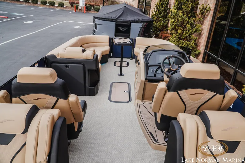 Slide: The Image of Luxurious 2026 Evotti 725QL boat interior with plush seating at Lake Norman Marina. - 9