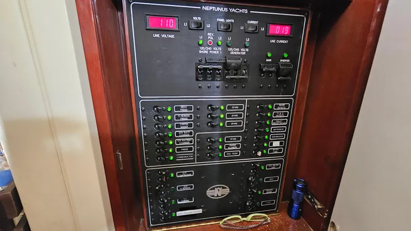Slide: The Image of Electrical panel of 2005 Neptunus 56 Flybridge yacht with control switches and indicators. - 37