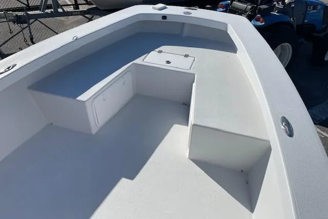 Slide: The Image of 2017 Intruder 23 boat interior with storage compartments and seating. - 16