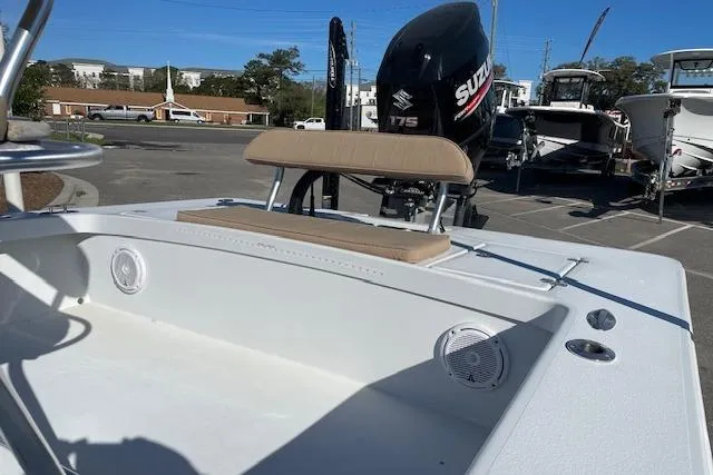 Slide: The Image of 2017 Intruder 23 boat with Suzuki 175 engine, featuring seating and speakers. - 8