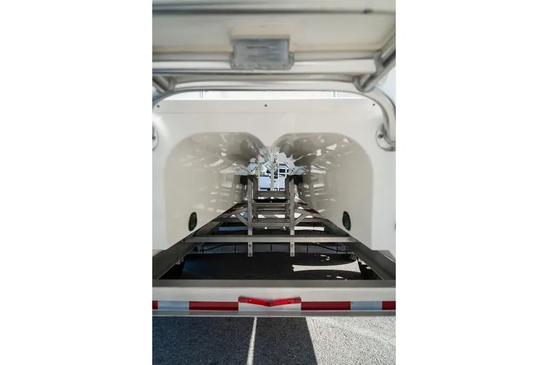 Slide: The Image of 2024 World Cat 295 CC boat hull on trailer, showcasing dual hull design. - 16