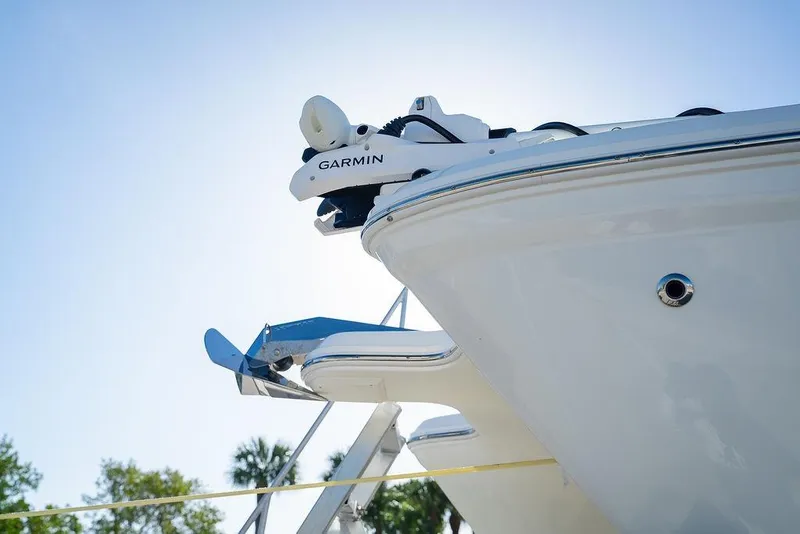 Slide: The Image of 2024 World Cat 295 CC boat with Garmin equipment, viewed from below against blue sky. - 20