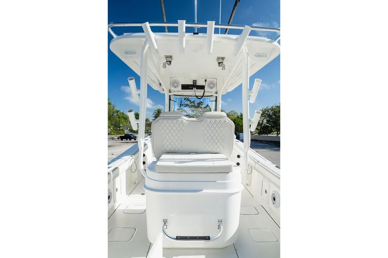 Slide: The Image of 2024 World Cat 295 CC boat interior with white seating and rod holders. - 37