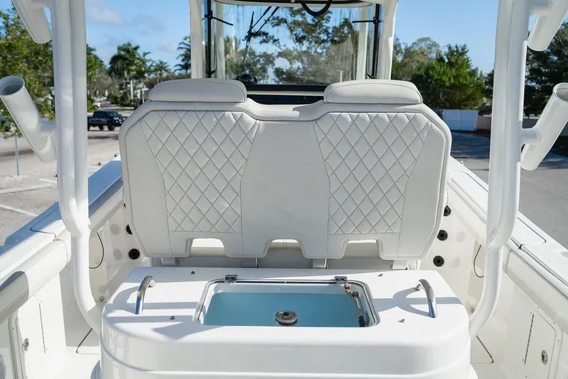 Slide: The Image of 2024 World Cat 295 CC boat interior with diamond-stitched seating and livewell. - 38