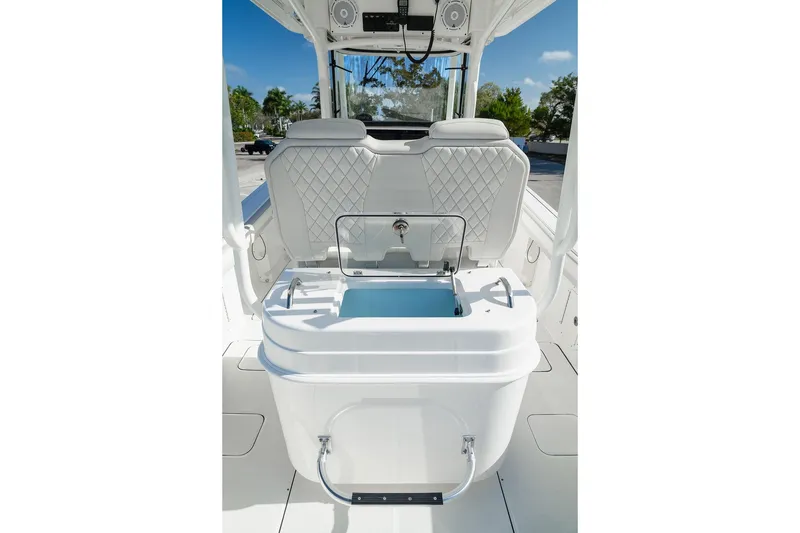 Slide: The Image of 2024 World Cat 295 CC boat interior with seating and storage compartment. - 39