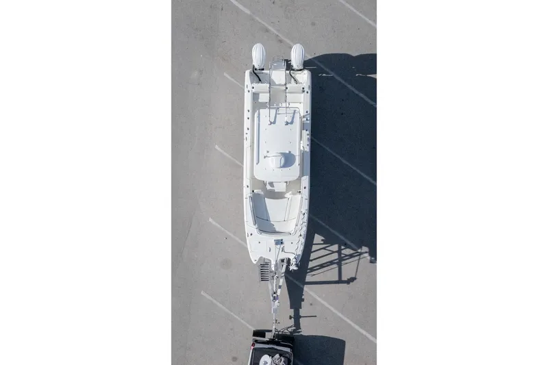 Slide: The Image of Aerial view of 2024 World Cat 295 CC boat on trailer in parking lot. - 40