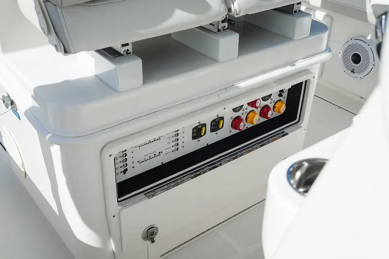 Slide: The Image of 2024 World Cat 295 CC boat control panel with switches and seating. - 54