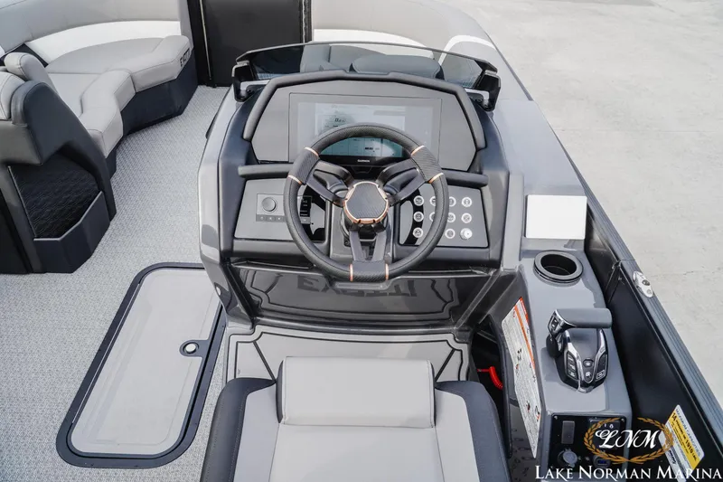 Slide: The Image of 2026 Evotti 723QL boat dashboard with steering wheel and control panel. - 11