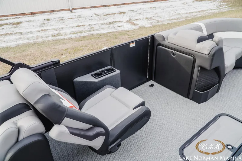 Slide: The Image of Interior of 2026 Evotti 723QL boat with plush seating and cup holders. - 12