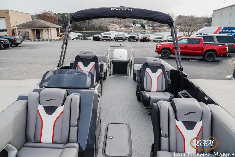 Slide: The Image of 2026 Evotti 723QL pontoon boat with sleek seating at Lake Norman Marina. - 15