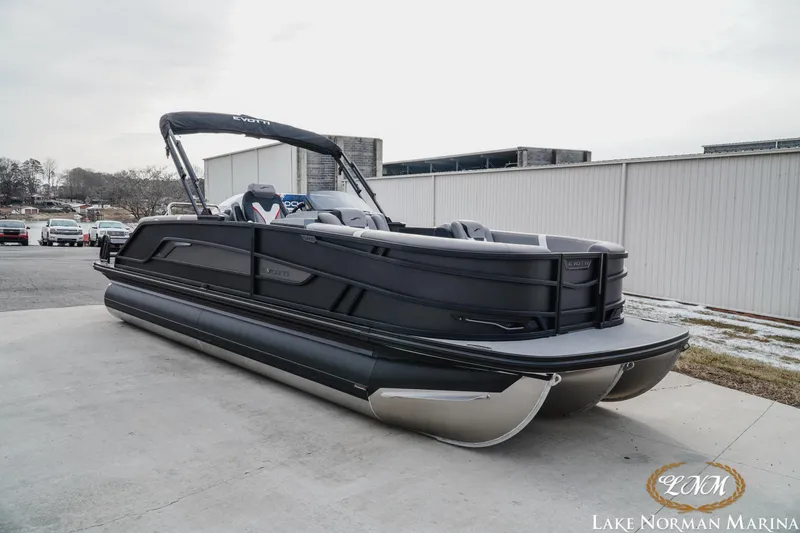 Slide: The Image of 2026 Evotti 723QL pontoon boat at Lake Norman Marina, featuring sleek black design. - 4