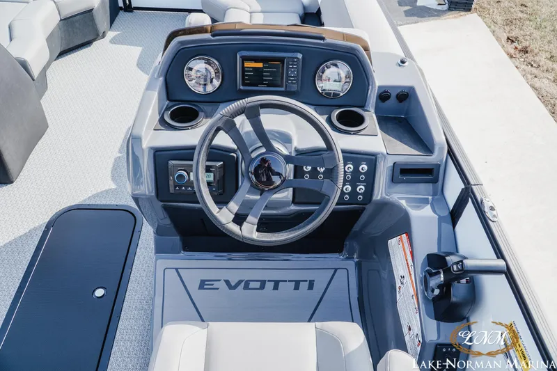 Slide: The Image of 2026 Evotti 521CS boat dashboard with steering wheel and control panel. - 10