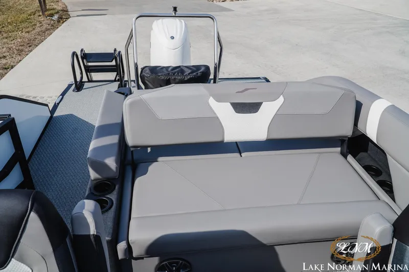 Slide: The Image of 2026 Evotti 521CS boat interior with gray seating at Lake Norman Marina. - 16