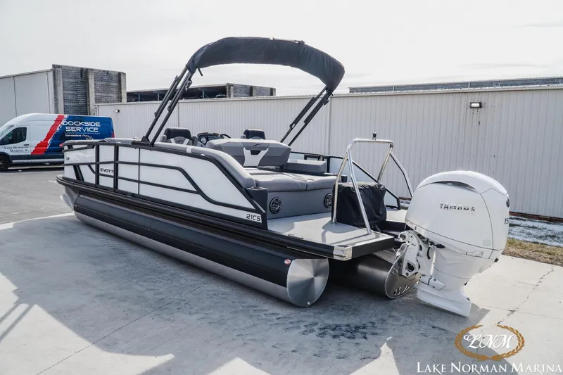 Slide: The Image of 2026 Evotti 521CS pontoon boat at Lake Norman Marina, featuring a sleek design and powerful engine. - 3