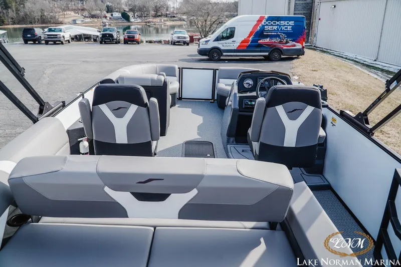 Slide: The Image of 2026 Evotti 521CS boat interior with modern seating at Lake Norman Marina. - 5