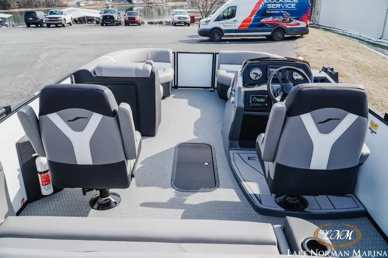 Slide: The Image of 2026 Evotti 521CS boat interior with modern seating and dashboard at Lake Norman Marina. - 7