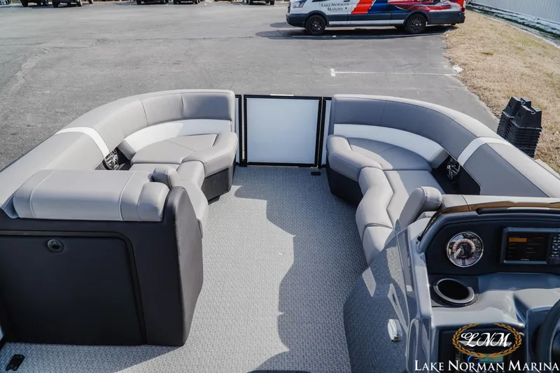 Slide: The Image of 2026 Evotti 521CS boat interior with gray seating at Lake Norman Marina. - 8