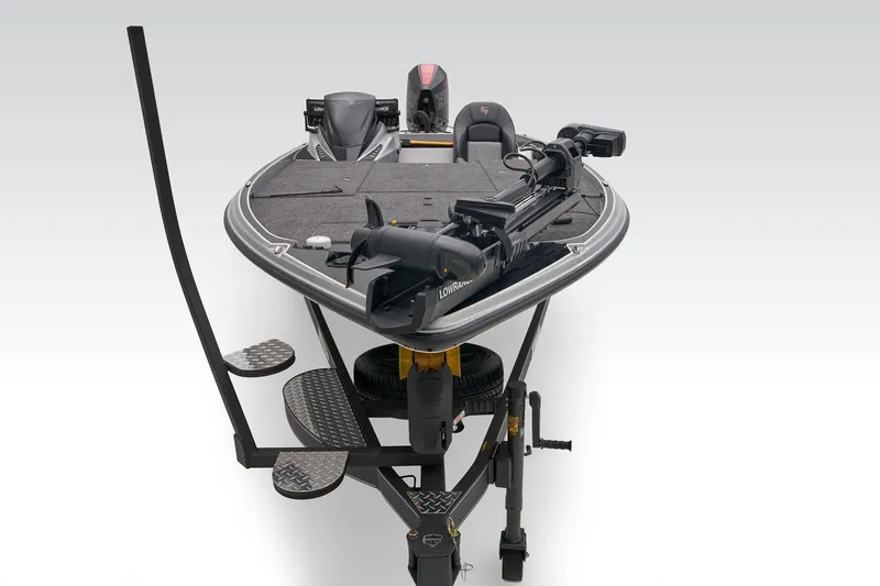 Slide: The Image of Storage compartment in 2026 Triton 21XP Patriot boat with sonar equipment and packaging. - 14