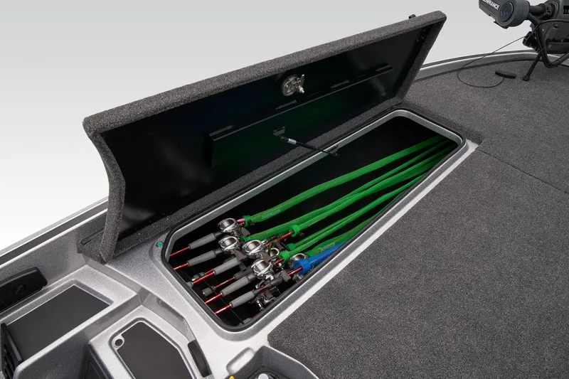 Slide: The Image of 2026 Triton 21XP Patriot boat battery compartment with green Interstate batteries and wiring. - 28