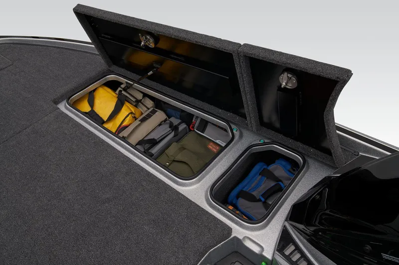 Slide: The Image of Storage compartment of 2026 Triton 21XP Patriot boat, featuring carpeted interior. - 31