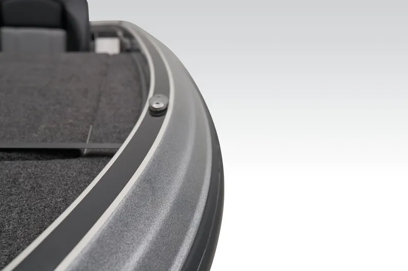 Slide: The Image of Open storage compartment on 2026 Triton 21XP Patriot boat, featuring carpeted interior. - 32