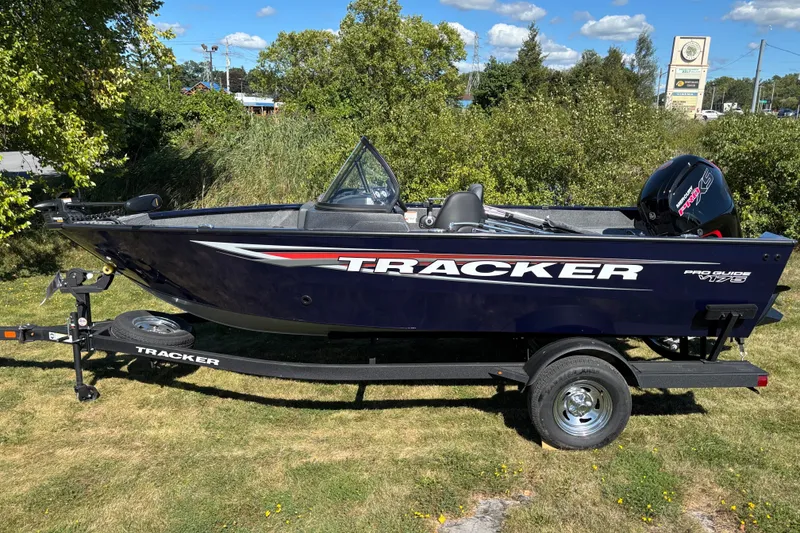 The Image of 2026 Tracker Pro Guide V-175 Combo boat on trailer, parked on grass. - 0