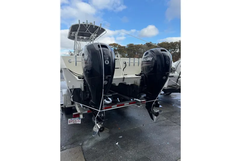 Slide: The Image of 2014 AmeraCat 27 boat with dual Mercury outboard engines on a trailer. - 3