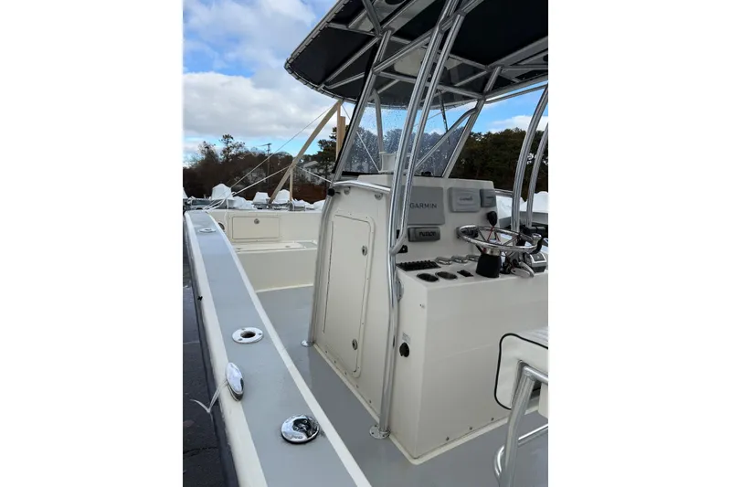 Slide: The Image of 2014 AmeraCat 27 boat cockpit with steering wheel and navigation equipment. - 5