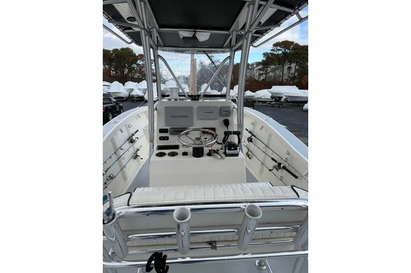 Slide: The Image of 2014 AmeraCat 27 boat cockpit with Garmin navigation system and fishing rod holders. - 6