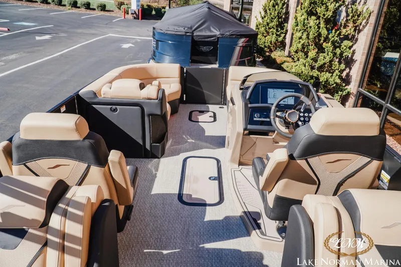 Slide: The Image of Luxurious 2026 Evotti 723QL boat interior with plush seating and modern dashboard at Lake Norman Marina. - 10