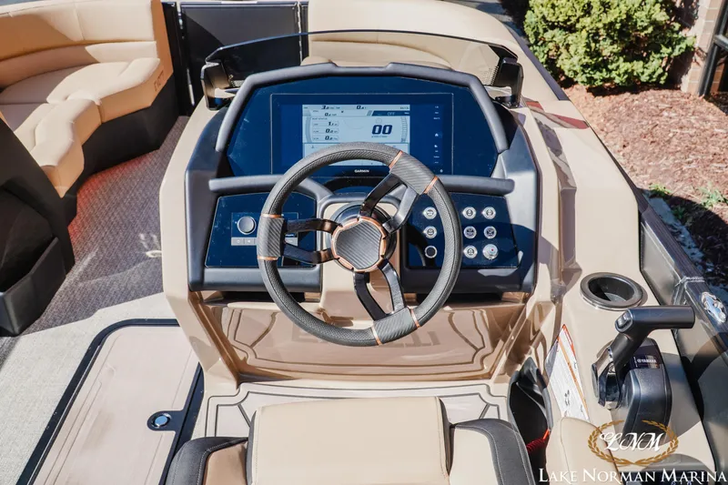 Slide: The Image of Steering console of 2026 Evotti 723QL boat with modern controls and seating. - 13