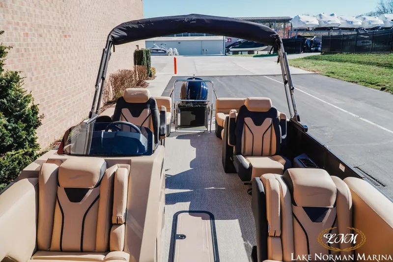 Slide: The Image of Luxury Evotti 723QL pontoon boat, 2026 model, with plush seating at Lake Norman Marina. - 17