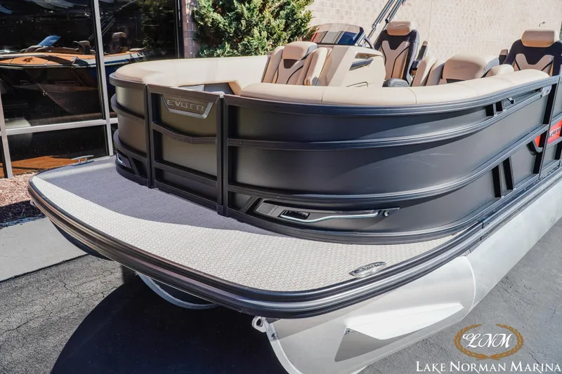 Slide: The Image of 2026 Evotti 723QL pontoon boat at Lake Norman Marina, featuring sleek design and comfortable seating. - 3