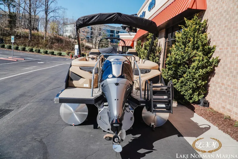 Slide: The Image of 2026 Evotti 723QL pontoon boat at Lake Norman Marina, featuring a powerful 250 engine. - 5