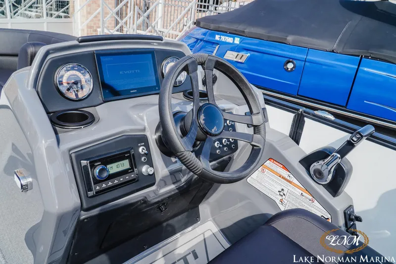 Slide: The Image of Cockpit of 2026 Evotti 523CS boat with steering wheel and control panel. - 10
